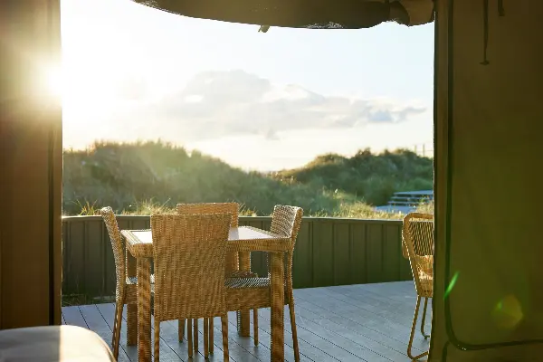 Dining area overlooking the hills from an eco-tent.