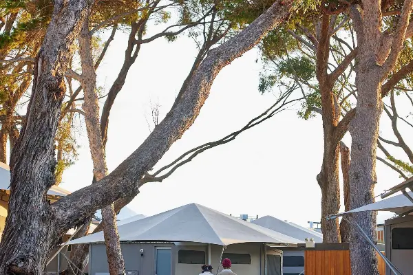 Couple walking though Discovery Resorts – Rottnest Island.