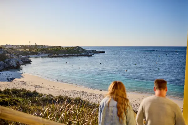 A couple enjoying the view of a beach