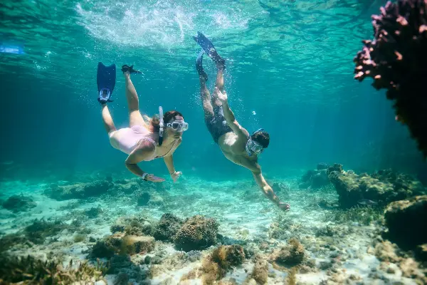 Couple snorkelling underwater