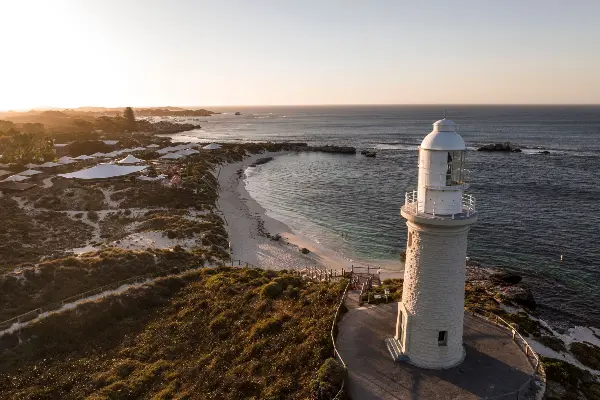 A white lighthouse overlooking Pinky Beach.