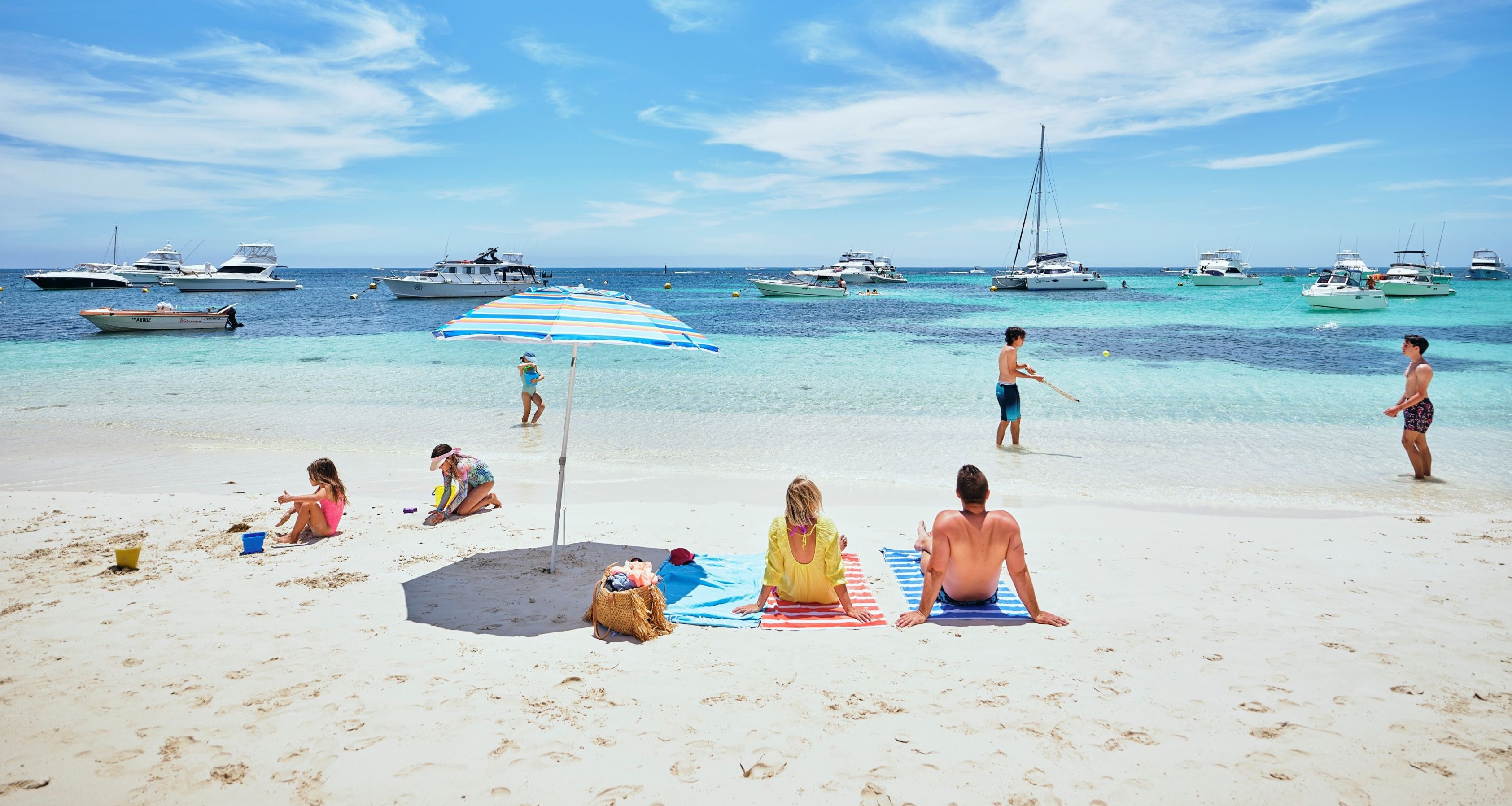 Family sitting at Longreach Bay on a hot summer's day.
