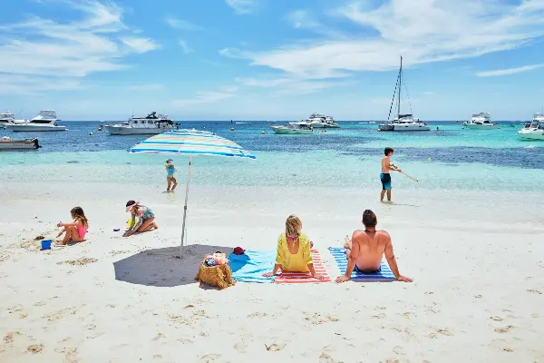 Family sitting at Longreach Bay on a hot summer's day.