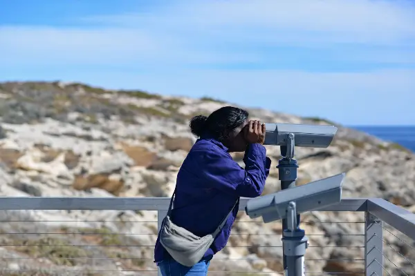 A person looking into binoculars