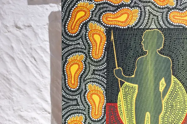 An Aboriginal artwork up close with intricately painted lines and markings.