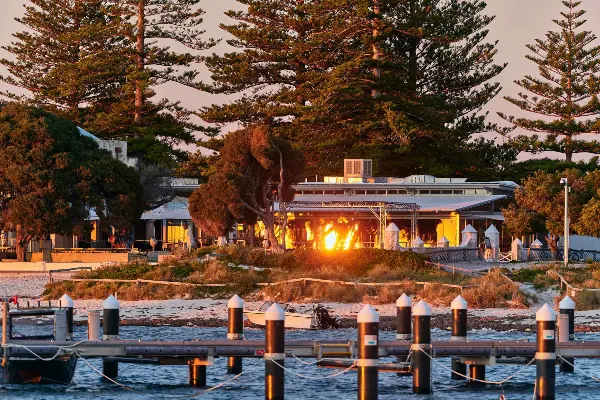 Looking across the water at Thomson Bay towards Hotel Rottnest at sunrise
