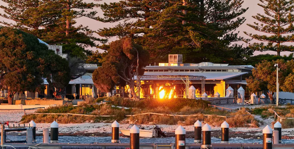 Looking across the water at Thomson Bay towards Hotel Rottnest at sunrise