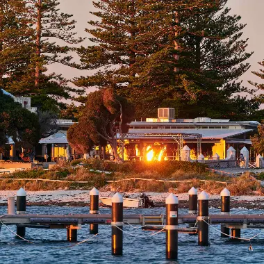 Looking across the water at Thomson Bay towards Hotel Rottnest at sunrise