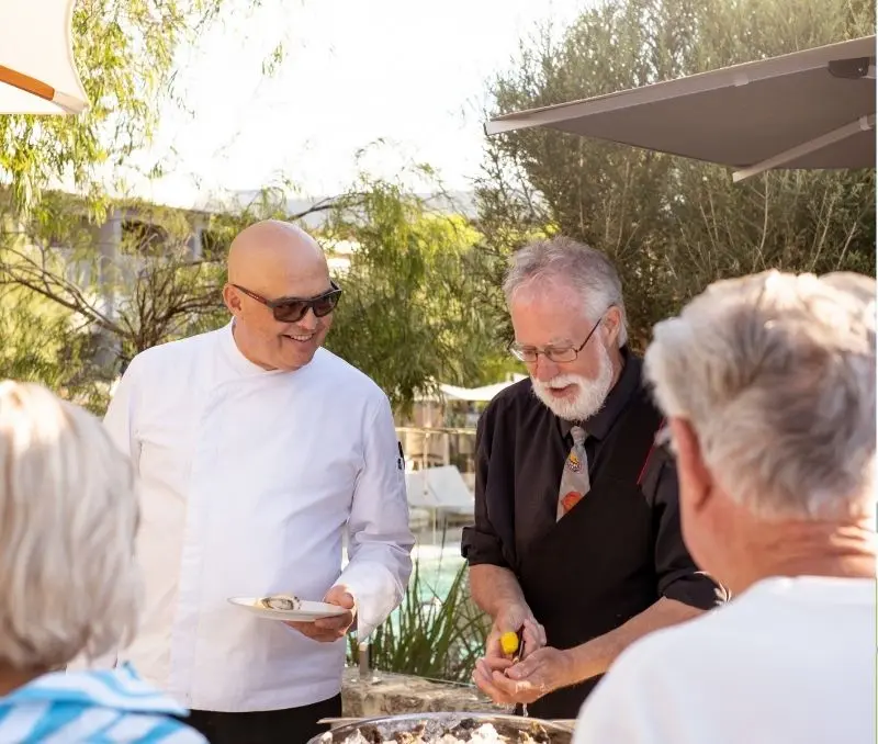 A chef doing a live cooking demonstration.