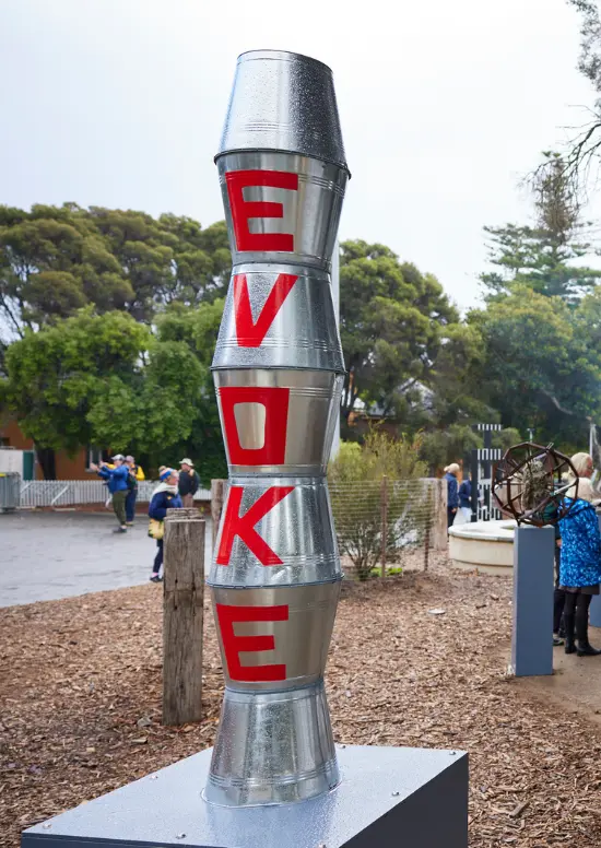 Evoke (2023) sculpture by artist Tania Ferrier. Materials used include Galvanised steel buckets, pole and paint.