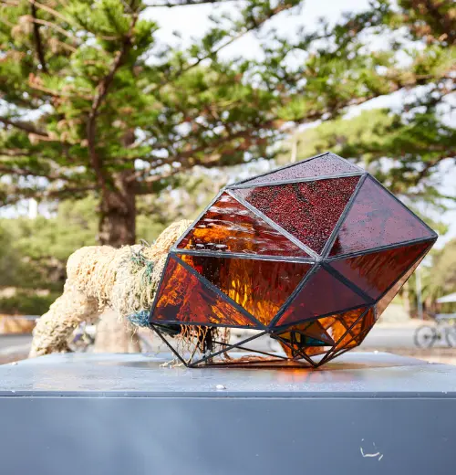 The Wadjemup Seedpod (2023) sculpture by artists  Alessandra Rossi and Andrea Carter. Materials used  Natural and synthetic fibre, stainless steel, glass .