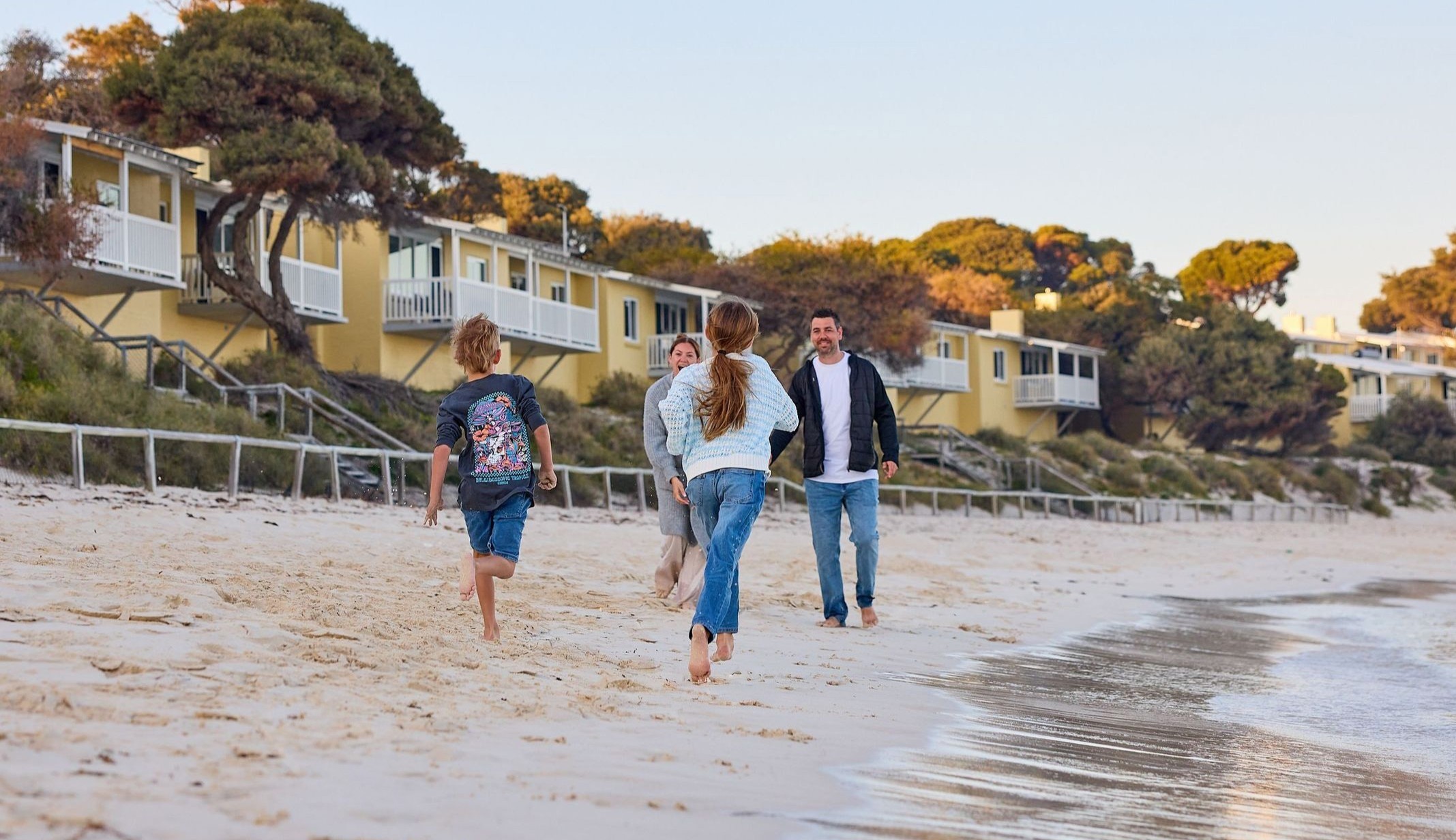 Family enjoying the beach on a cool Autumn evening at Wadjemup / Rottnest Island.