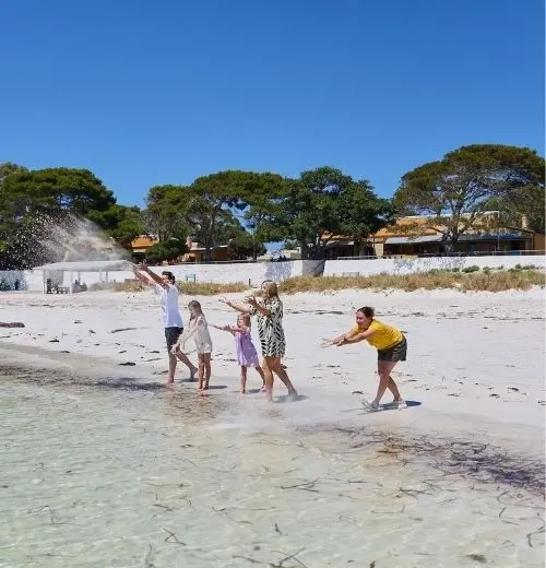 Five people doing a sand ceremony