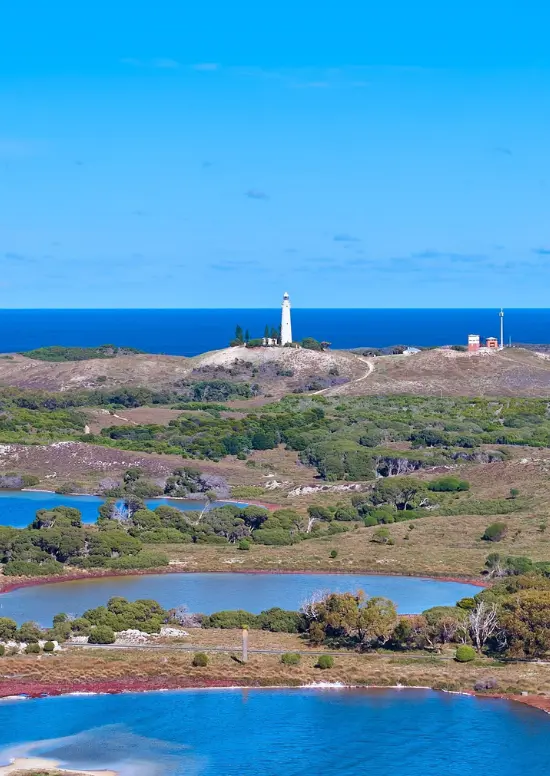 Aerial of salt lakes with Wadjemup Lighthouse in background