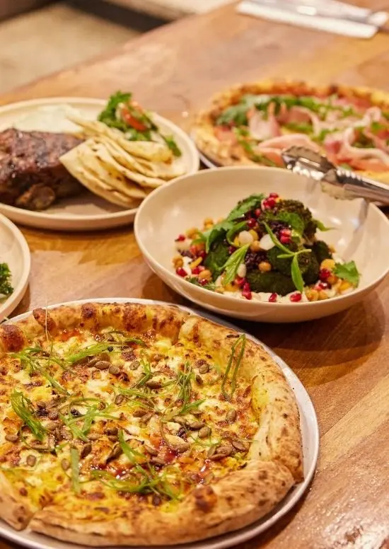 Five meals of pub classics on a table