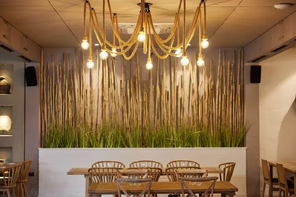 A rope chandler over a couple tables.