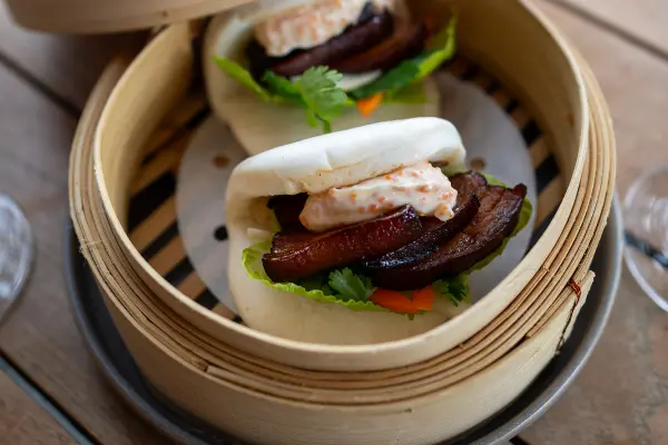 Two Bao Buns in a steamer.