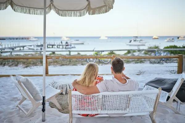 Couple sitting at The Beach Club at the Samphire.