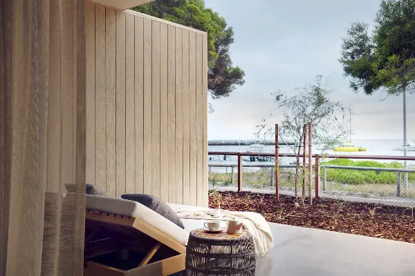 Relax on a patio overlooking the beach