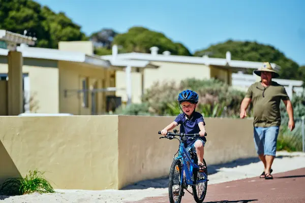 Family cycling through South Thomson