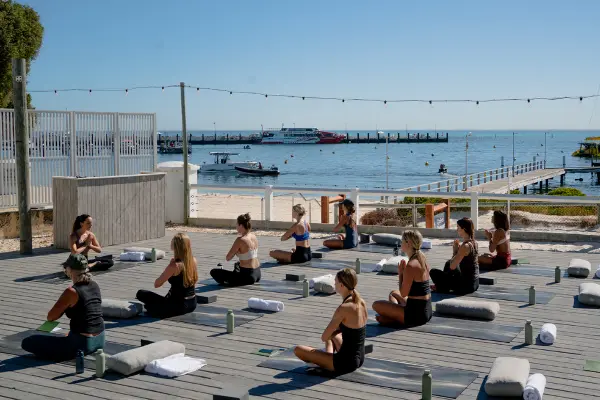 A yoga class outside.
